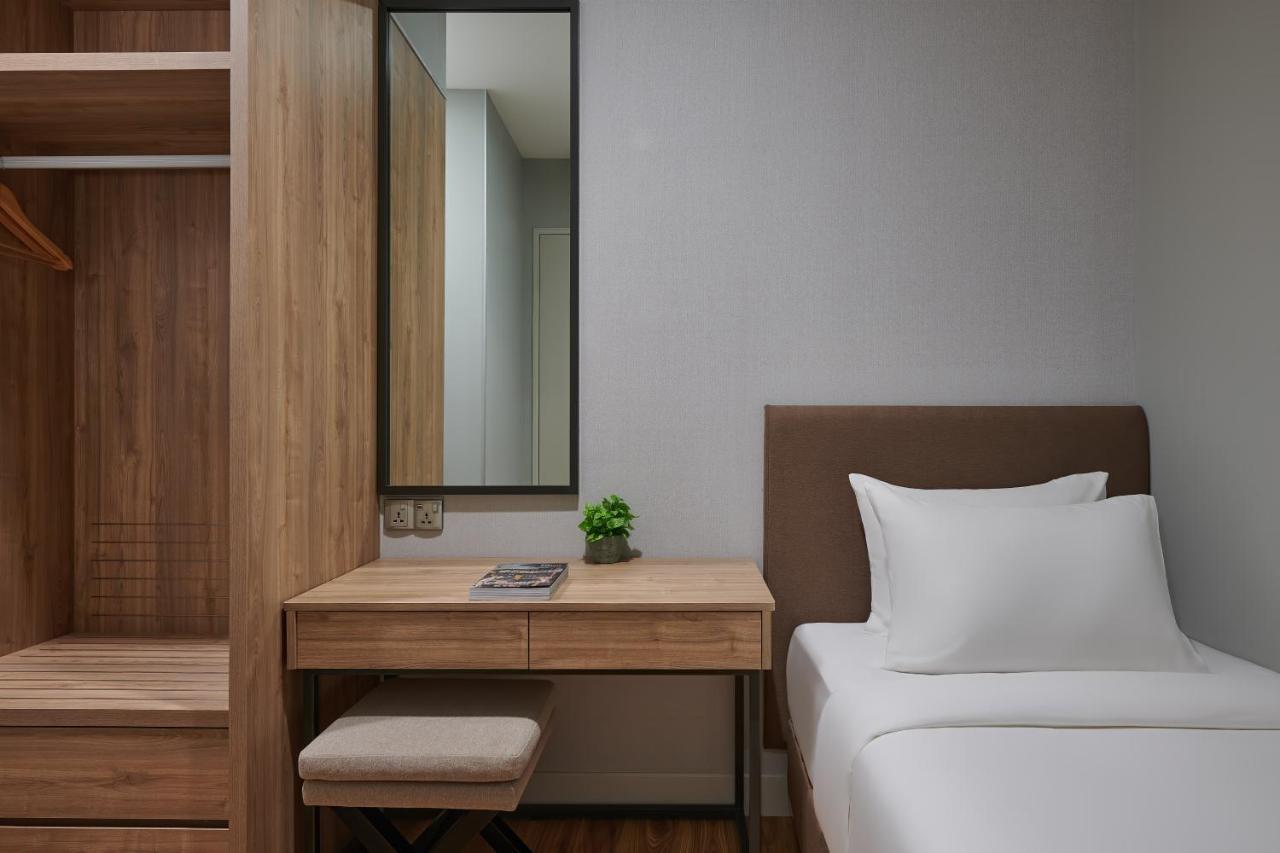 Mercure Living Путраджая Экстерьер фото A bedroom at the hotel